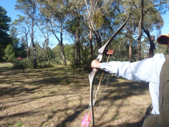 Craig letting one rip.This is the only photo taken showing an arrow in flight as his Predator was spitting them out that fast