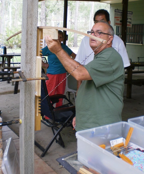 Glenn showing John how to check for an even Limb Taper.JPG