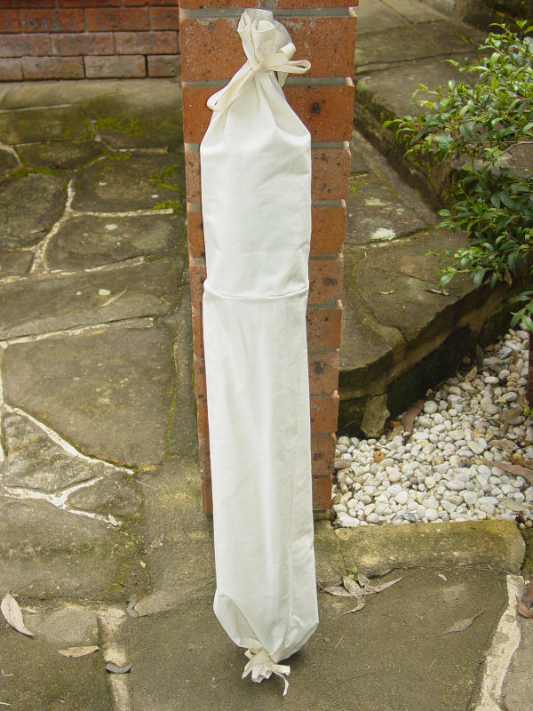 Arrow bag with the top part rolled up and tied in position