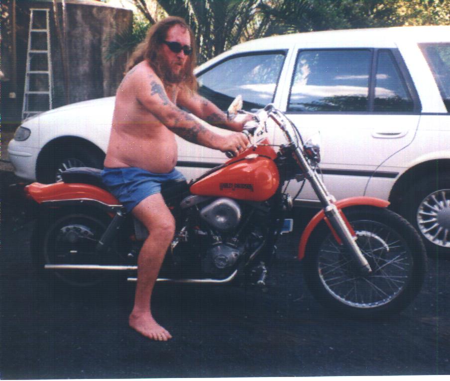 dad on his orange bike.JPG